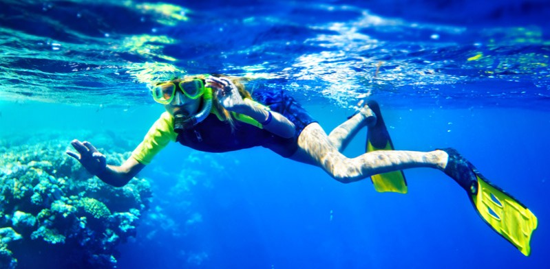 male snorkelling in the ocean