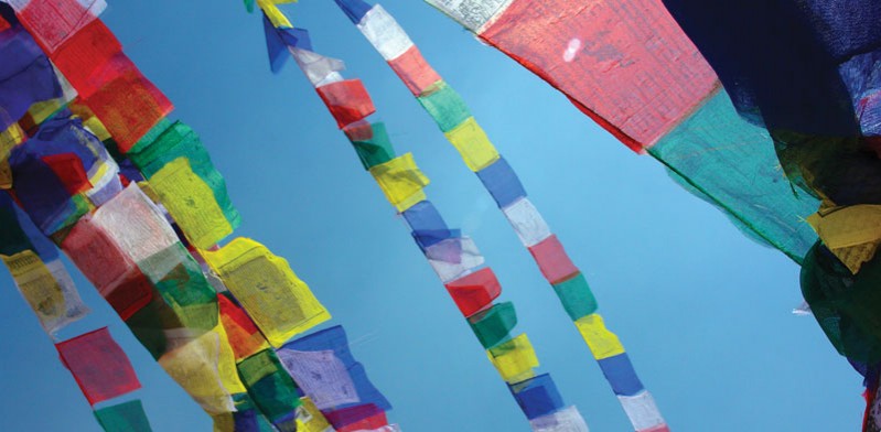prayer flags flying in the air in nepal