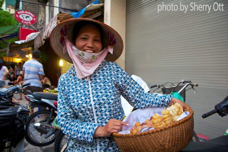 Friendly street vendor in Hanoi Vietnam