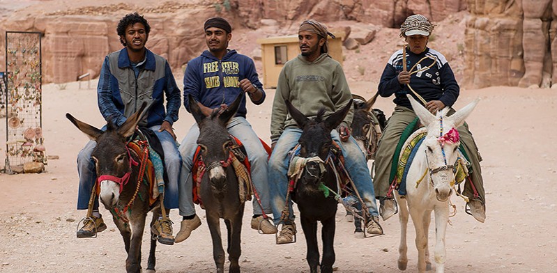 Locals riding donkeys in Jordan photo by Steve Davey