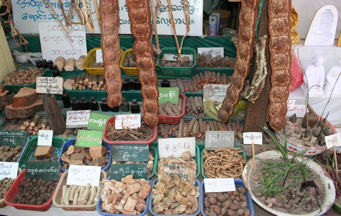 Market stall selling plants and timber