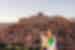 Travellers and leader overlook the city of Ait Benhaddou, Morocco