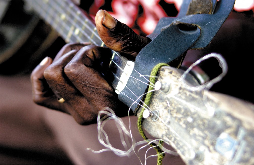 Hands of a man playing guitar