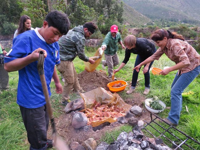 Preparing Pachamanca, a traditional Peruvian dish baked on hot stones