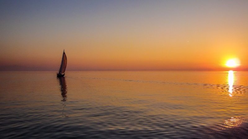 A sailing boat at sunset