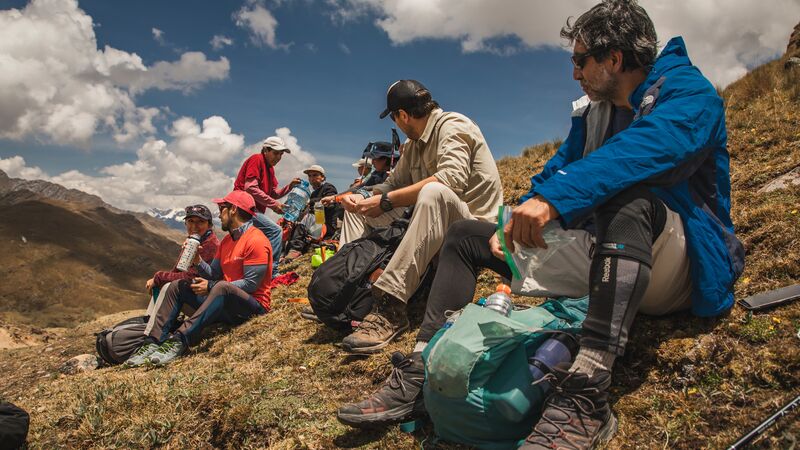 A group of hikers taking a rest on the Great Inca Trail hike in Peru