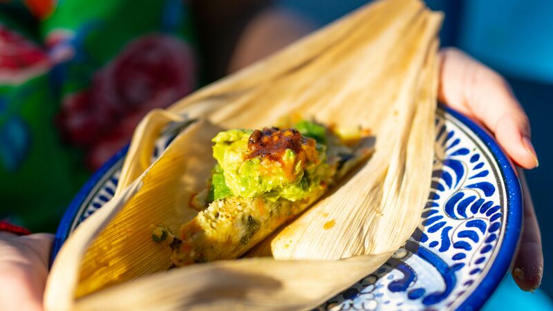 A tamale wrapped in a corn husk