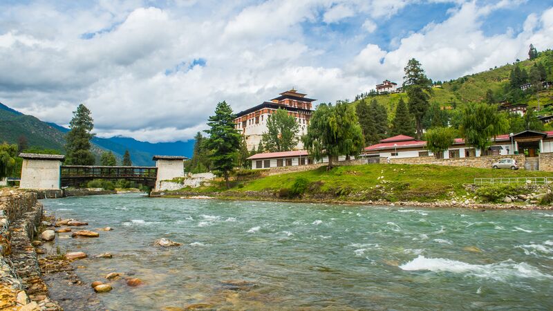 Old monastery in Bhutan next to a river