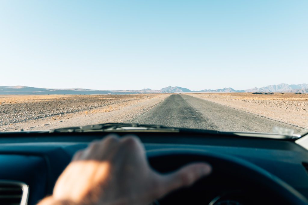 the-common-wanderer-driving-through-the-open-namibian-desert
