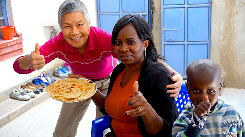 Taylor's mother makes chapatti with Cecilia