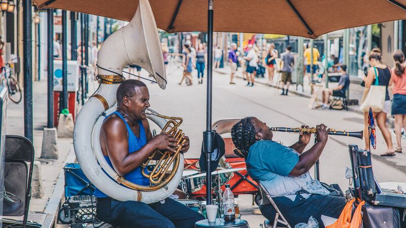 https://www.intrepidtravel.com/adventures/wp-content/uploads/2017/06/Intrepid-Travel-USA_New_Orleans_Bourbon_street_street_music_band_048.jpg