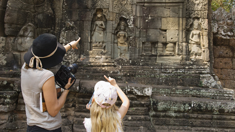 Mother and daughter studying Angkor Wat