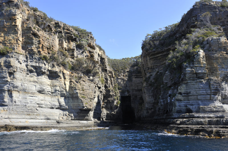 The two towering rock structures that make up Devil's Kitchen in Tasmania.