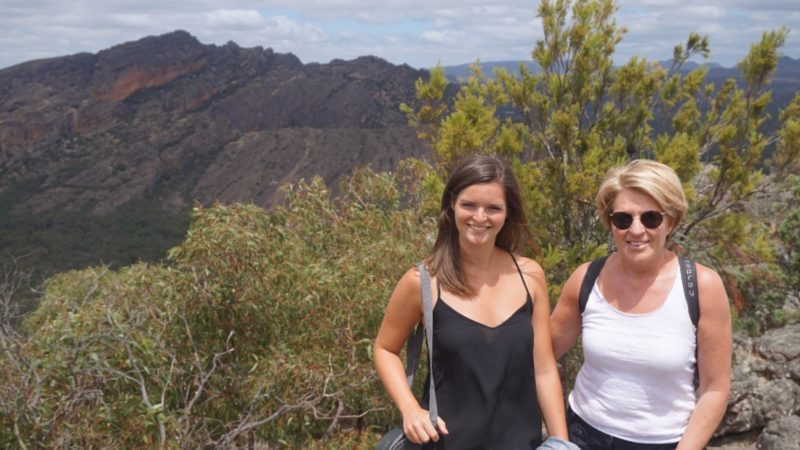 Two woman pose in the Australian bush after a hike