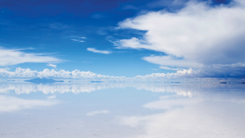 Reflections across the Salar de Uyuni salt flat in Bolivia