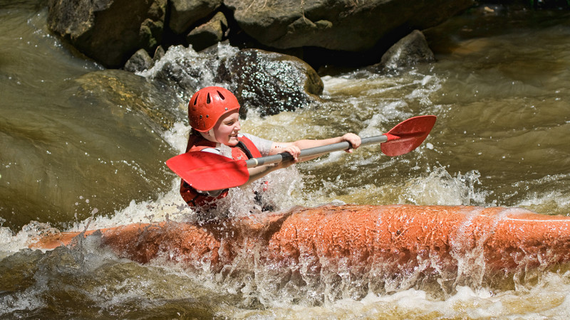 Teen kayaking in Croatia