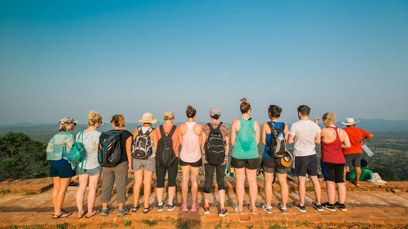 Eleven travellers standing on top of Sigiriya in Sri Lanka