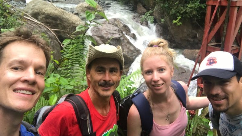 A selfie of a group of travellers beside the Savegre River in Costa Rica