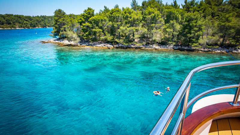 Two swimmers enjoy the pristine waters off the Croatian coast