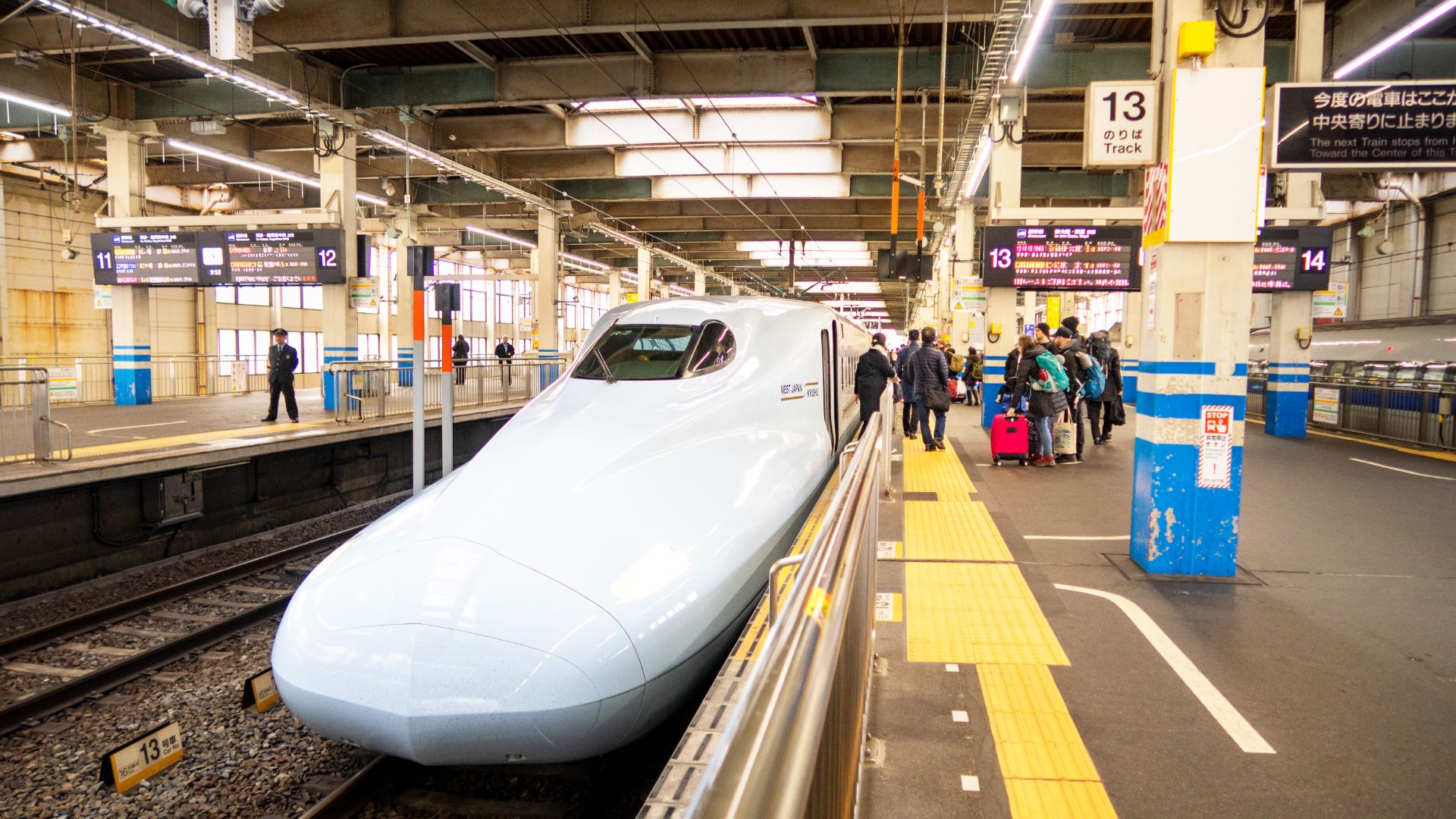 A shinkansen train at a station in Japan. 