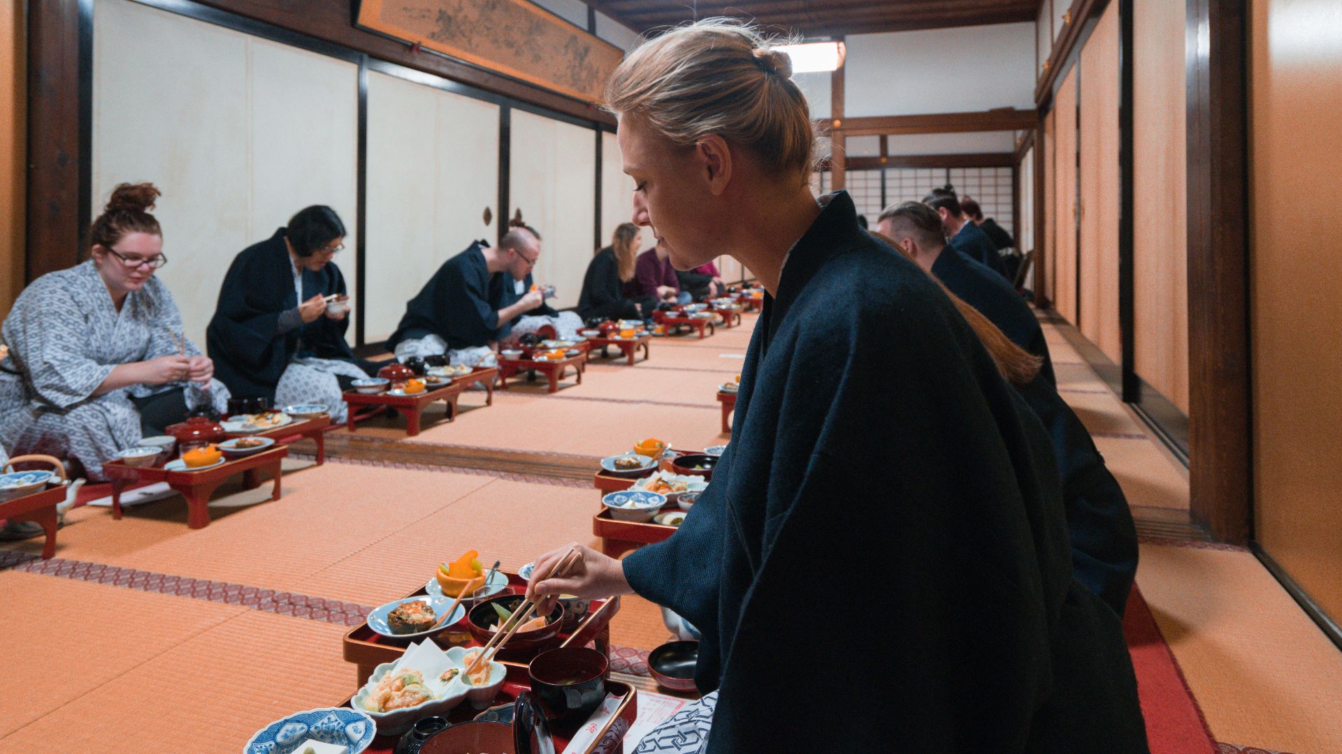 Travellers eating at a temple in Japan with Intrepid. 
