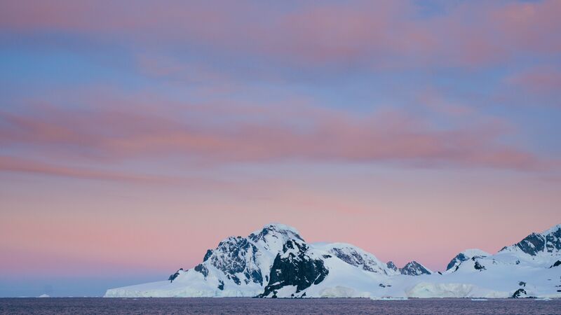 A distant snow-covered mountain in Antarctica