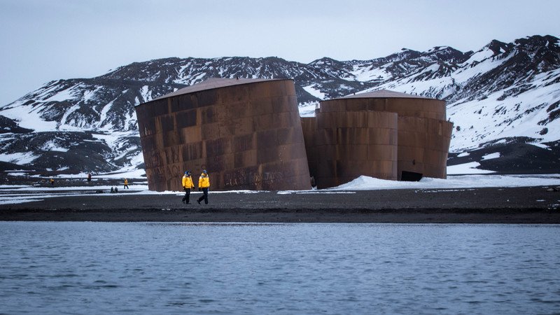 Two travellers on Deception Island, Antarctica