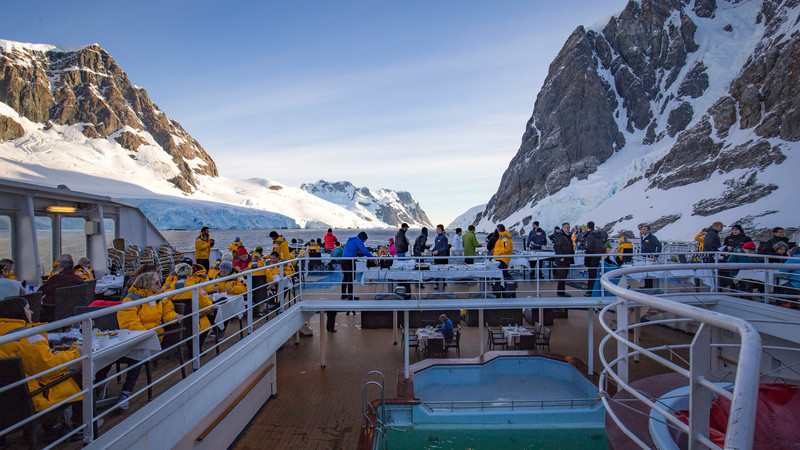 A group of travellers on a ship in Antarctica
