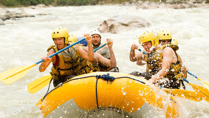 Travellers whitewater rafting in Costa Rica