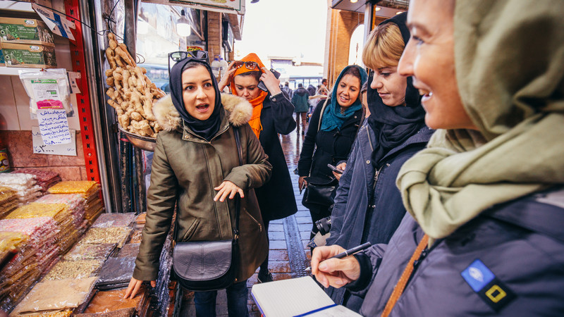 Female travellers at a market