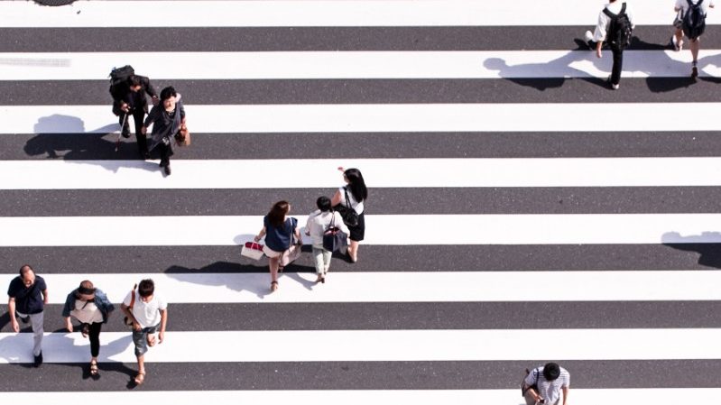 Aerial view of people crossing the road in Japan