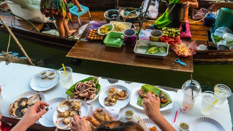 People enjoying food at the floating market