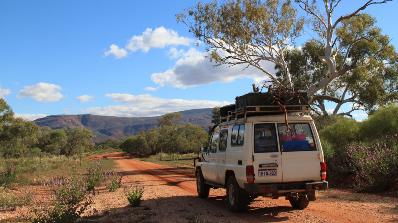 Overland truck on a dirt track by Mount Augustus, Australia