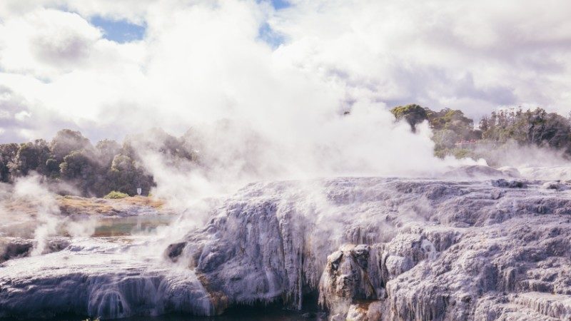 Bubbling geyser with white mist in New Zealand