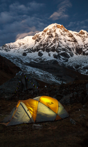 A tent and Annapurna South at sunrise as taken from Annapurna Base Camp