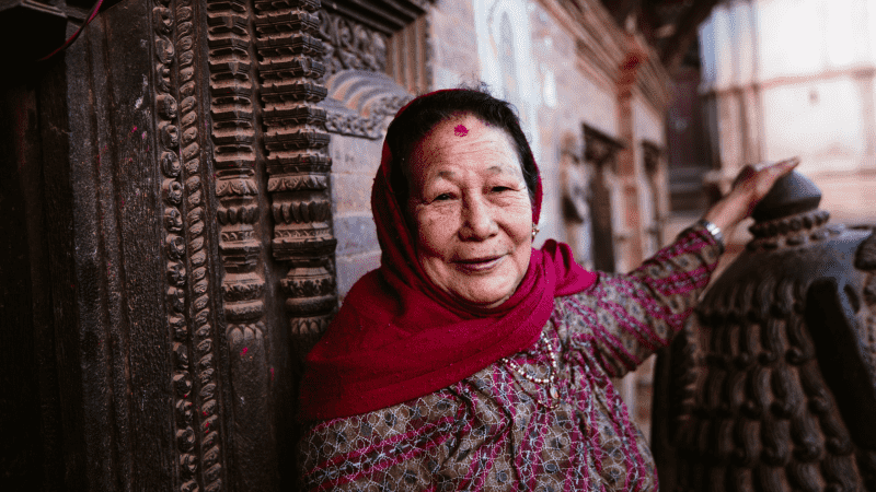 A woman outside a temple in Bhaktapur, Kathmandu Valley