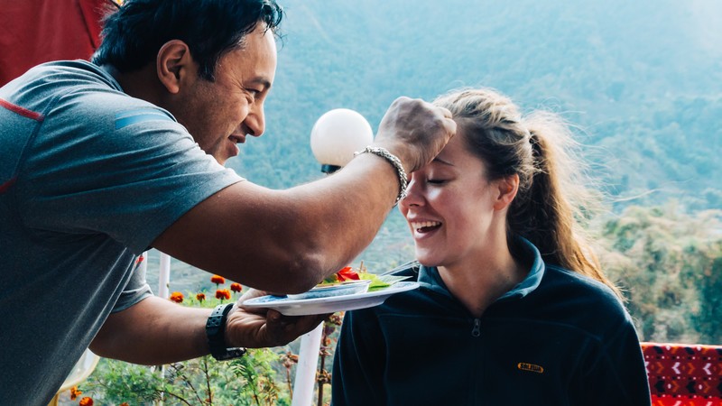 A young woman meets a local in Nepal