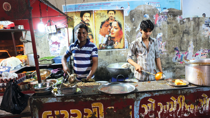 Local men preparing street food in India