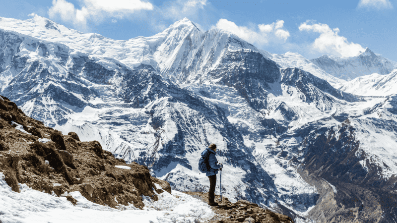 A hiker in front of Annapurna II, on the Annapurna Circuit Trek