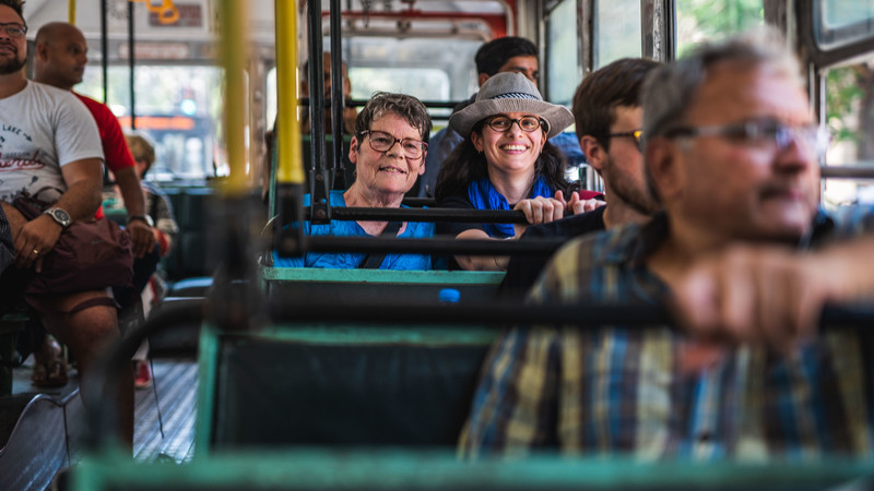 Two passengers on a bus in India