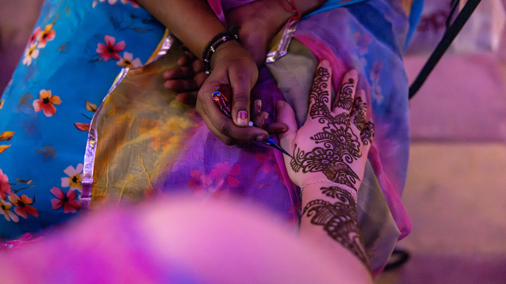 The art of mehndi being practiced during Diwali in India.