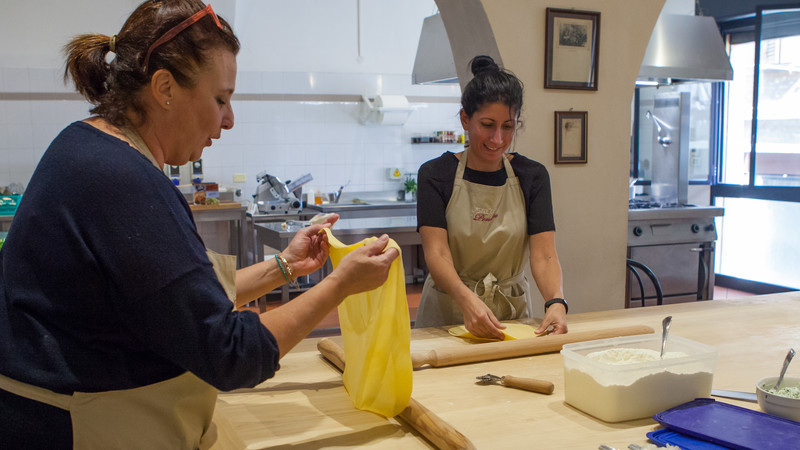 Two women making pasta