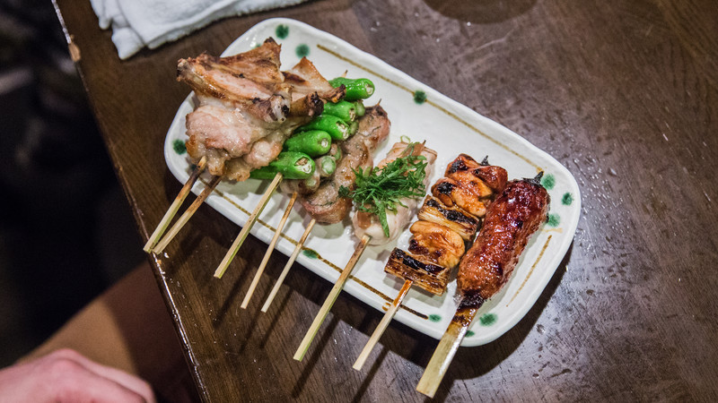 A plate of skewered food in Japan