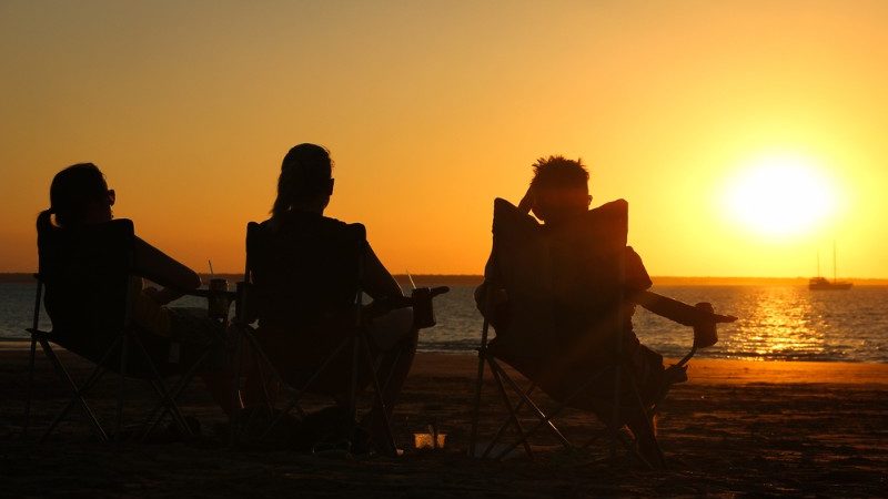 Sitting on the beach at sunset