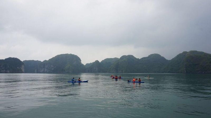 Travellers kayak on Lan Ha Bay
