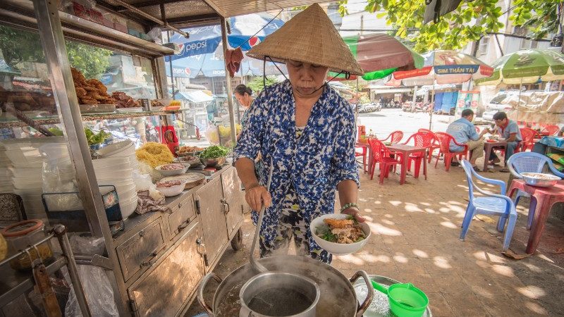 Vendor selling soup in Vietnam