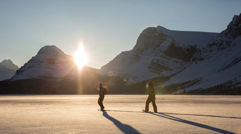 Two snow-shoers in Bow Lake, Canada