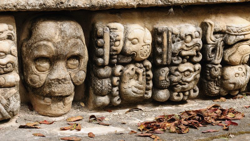 Close up of stones with intricate Maya ruins carved