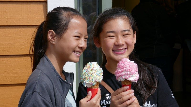 Two kids enjoying ice creams