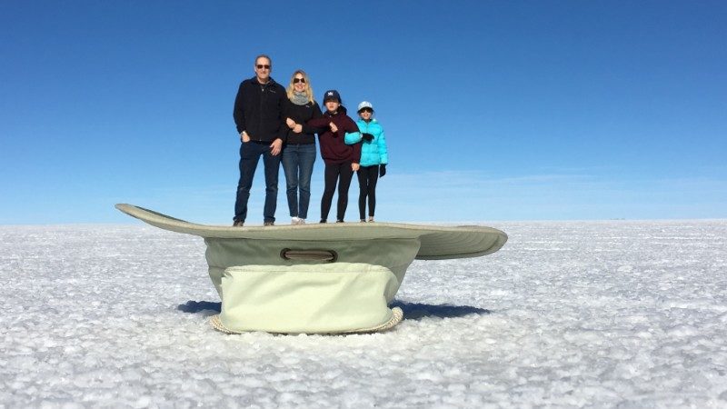 Family standing in a hat